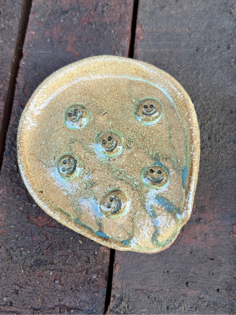 Hand Crafted tan and teal ceramic smile-spot Spoon Rest